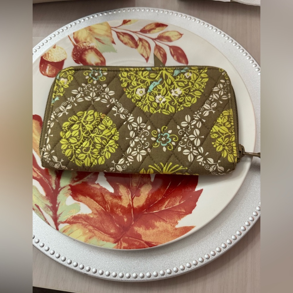 Vera Bradley wallet in green and brown pattern.